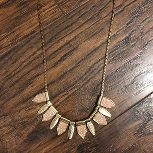 Gold sparkly necklace with feathers